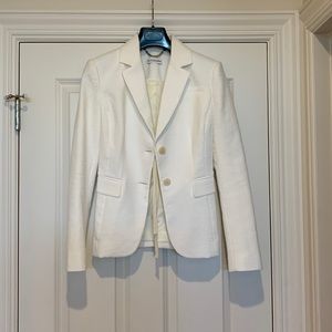 Altuzarra off white colored jacket in cotton/elastane. Made in Italy.
